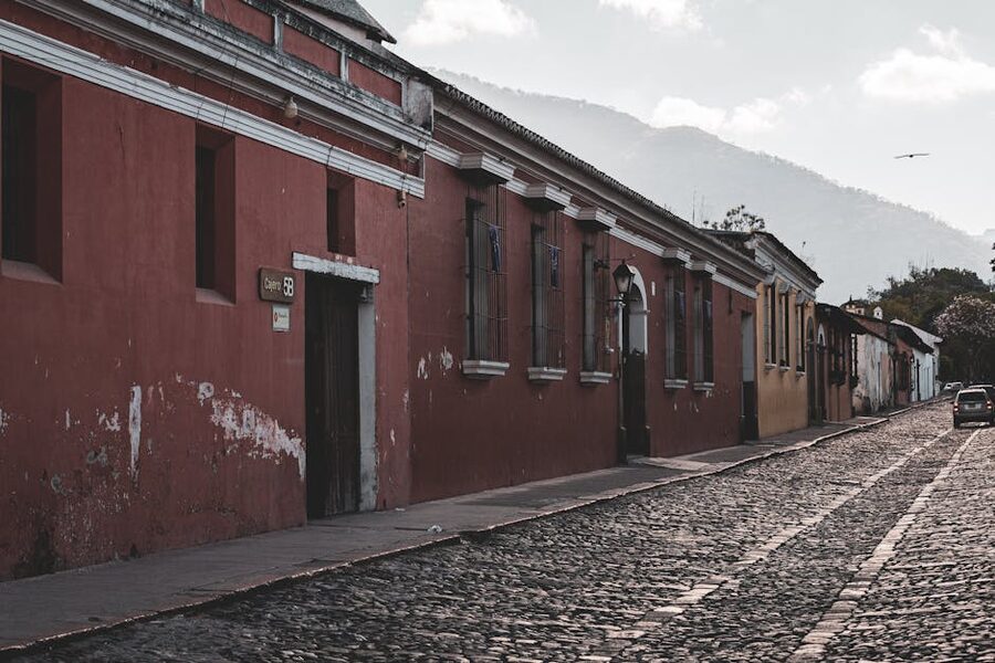 Cobblestone street in Antigua with Volcán de Agua at the end