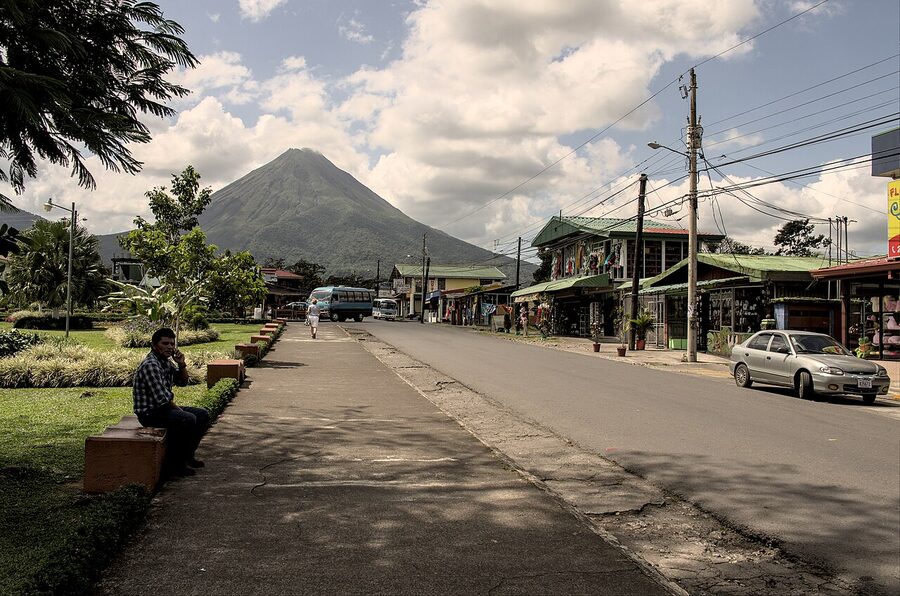 Arenal Volcano towering over La Fortuna town, Costa Rica