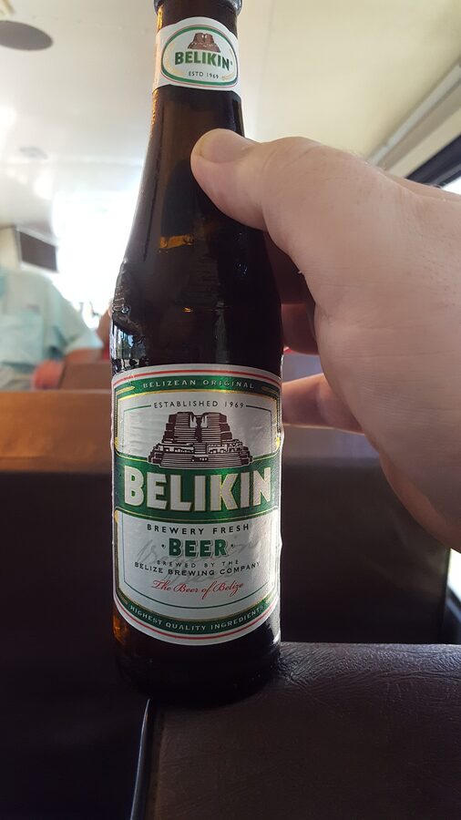 Bottle of Belikin Beer, the national beer of Belize, held in a hand