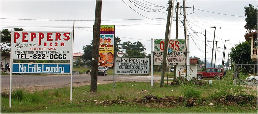 Belmopán roadside signs Peppers Pizza Hoy Eye Center Oasis Restaurant