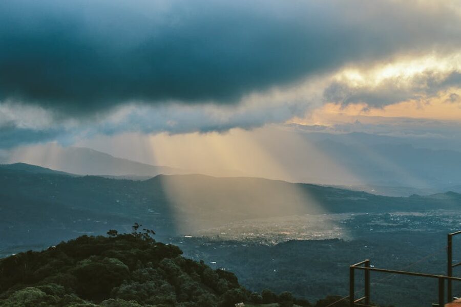 Sunbeams over green mountain landscape in Panama highlands