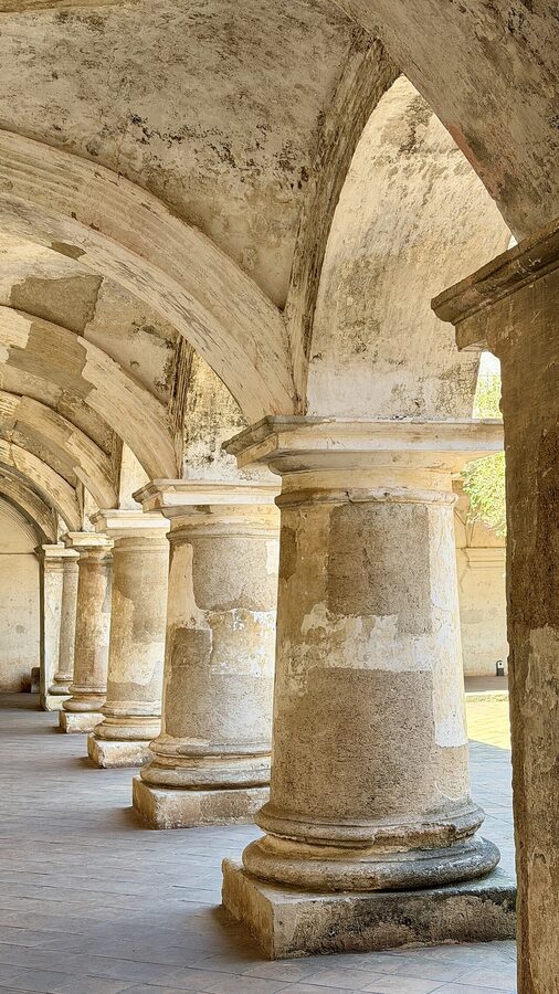 Stone arches and pillars at the Convento de las Capuchinas in Antigua Guatemala