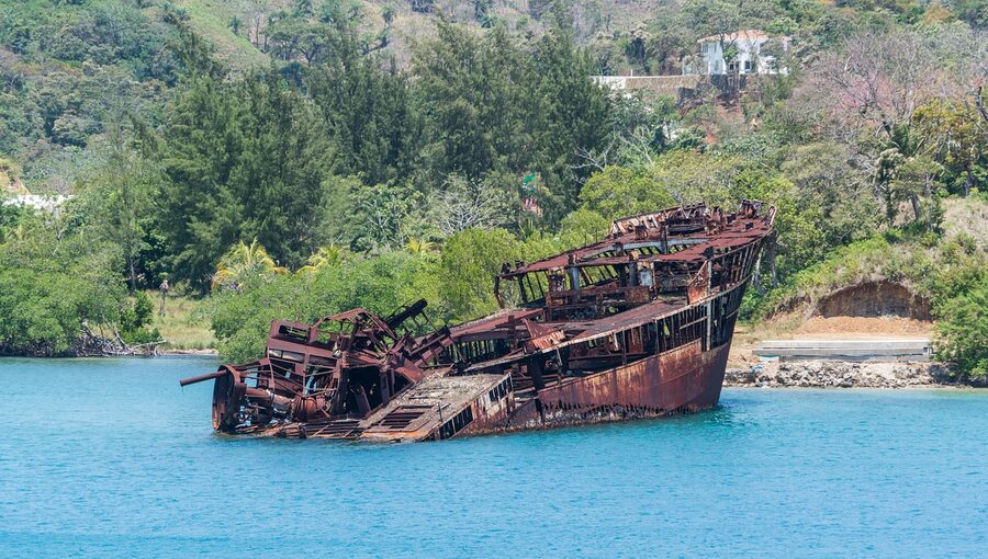 Mahogany Bay tropical scene with shipwreck on Roatan, Honduras