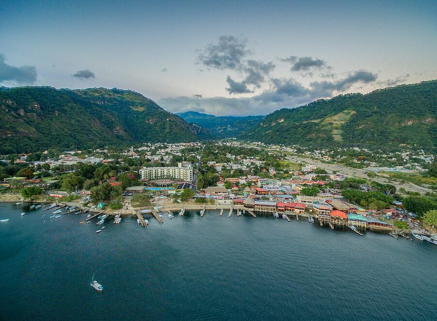 Aerial view of Panajachel showing the docks lakefront hotels and surrounding hills