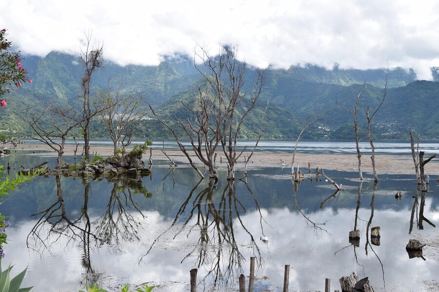 Mirror reflection of Volcan San Pedro on the still surface of Lake Atitlan at dawn