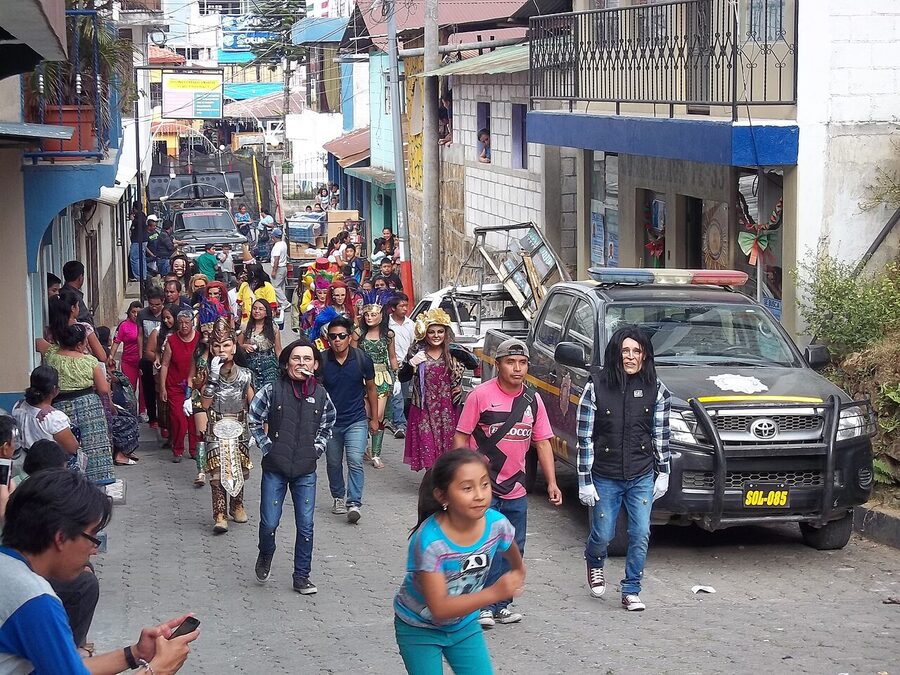 San Pedro La Laguna street scene with locals and police pickup truck
