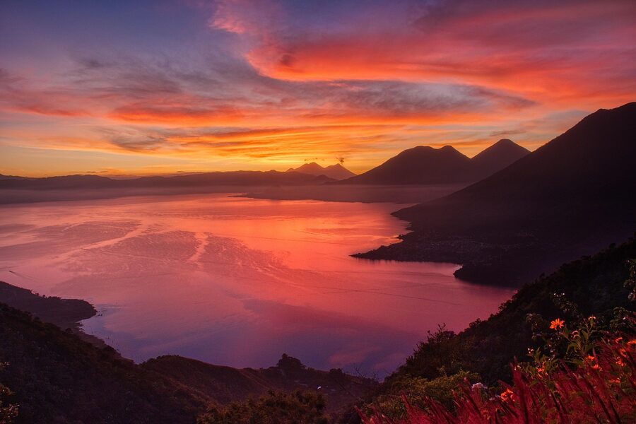 Sunrise over Lake Atitlan with volcano cone catching first light