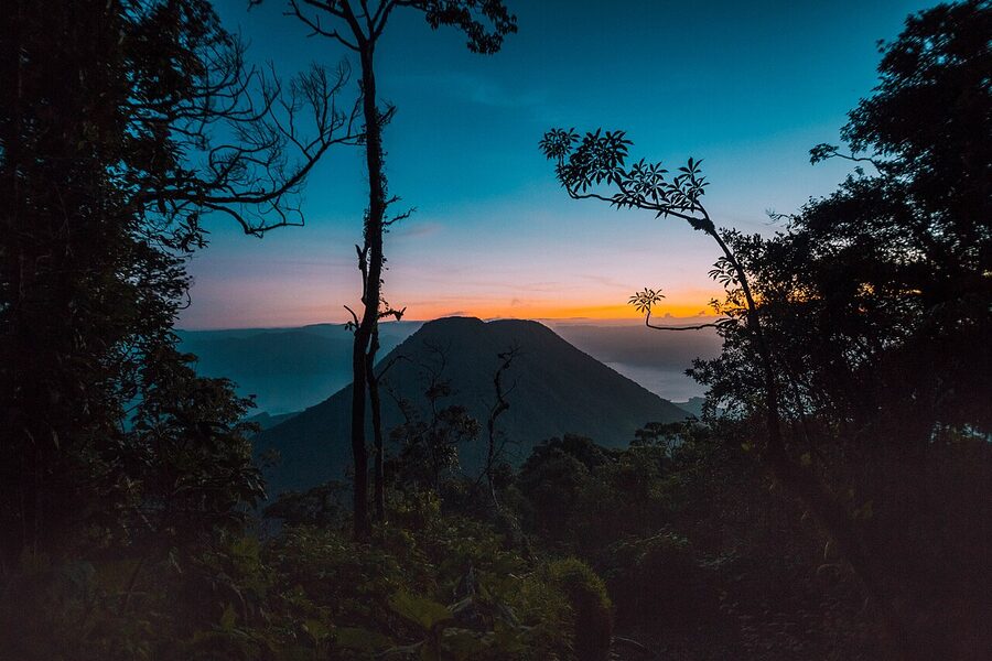 Volcan Toliman silhouette at sunrise from the eastern shore of Lake Atitlan