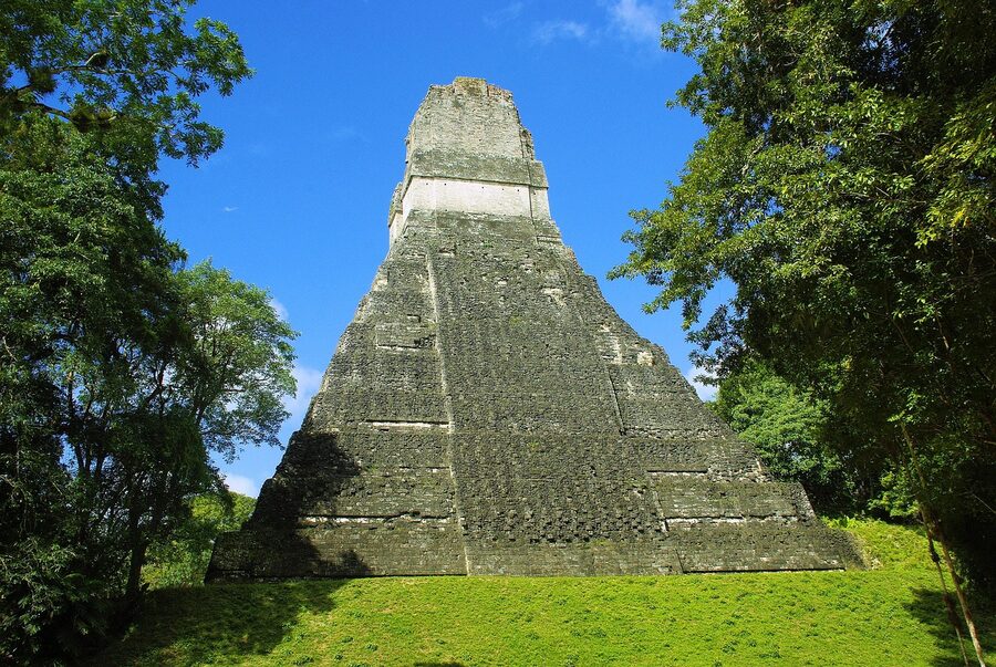 Tikal pyramid rising over the rainforest in Peten, Guatemala