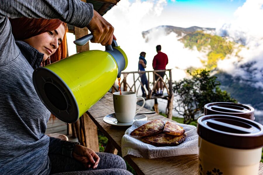 Pouring coffee with mountain view in Costa Rica