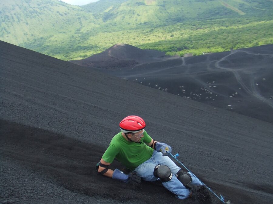 Tourists volcano boarding down Cerro Negro near León, Nicaragua