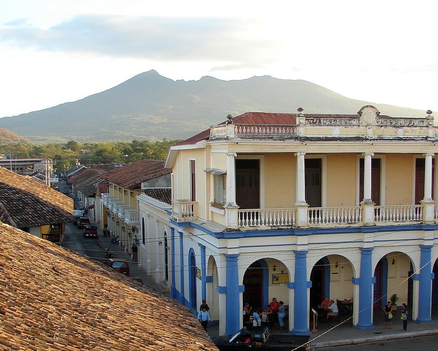Volcán Mombacho seen from Granada, Nicaragua, with city rooftops below
