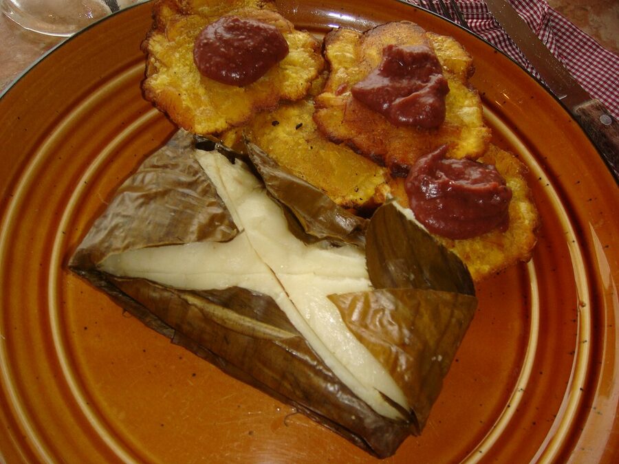 A nacatamal Nicaraguan tamale wrapped in banana leaf