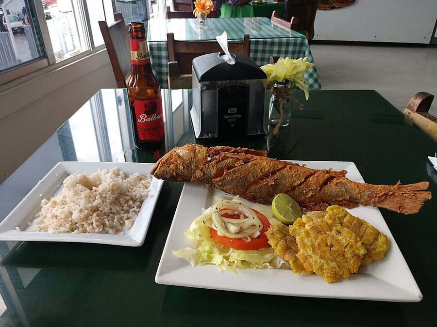 Whole fried fish with rice patacones and Balboa beer at the Mercado de Mariscos