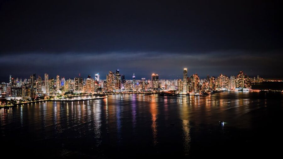 Panama City skyline lit up at night across the bay