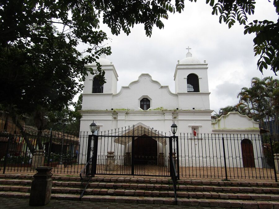 Side facade of the colonial church in Valle de Angeles with twin bell towers