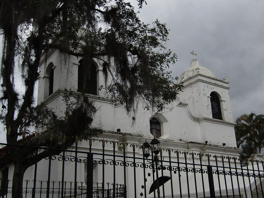 White colonial Iglesia de San Francisco de Asis church with bell tower in Valle de Angeles