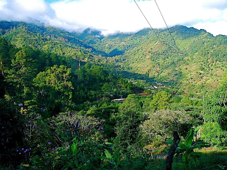 Mountain village San Juancito near Valle de Angeles surrounded by green hills