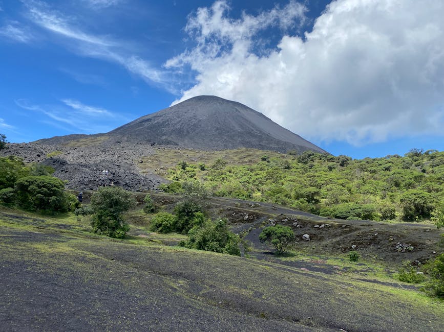 Pacaya Volcano landscape under blue sky in Guatemala, lava field foreground