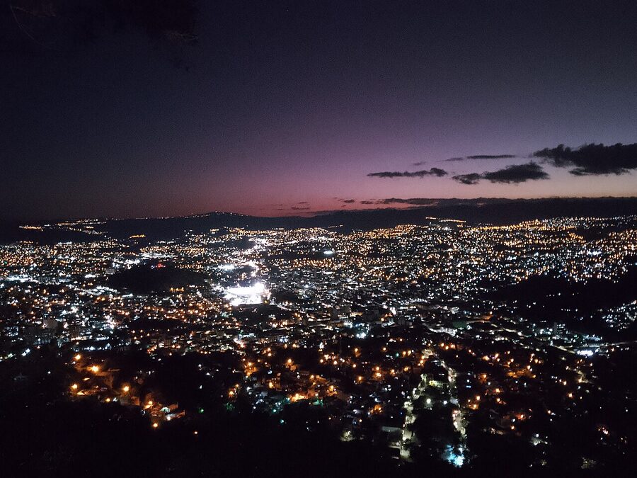Tegucigalpa night skyline glowing with thousands of lights spread across hills